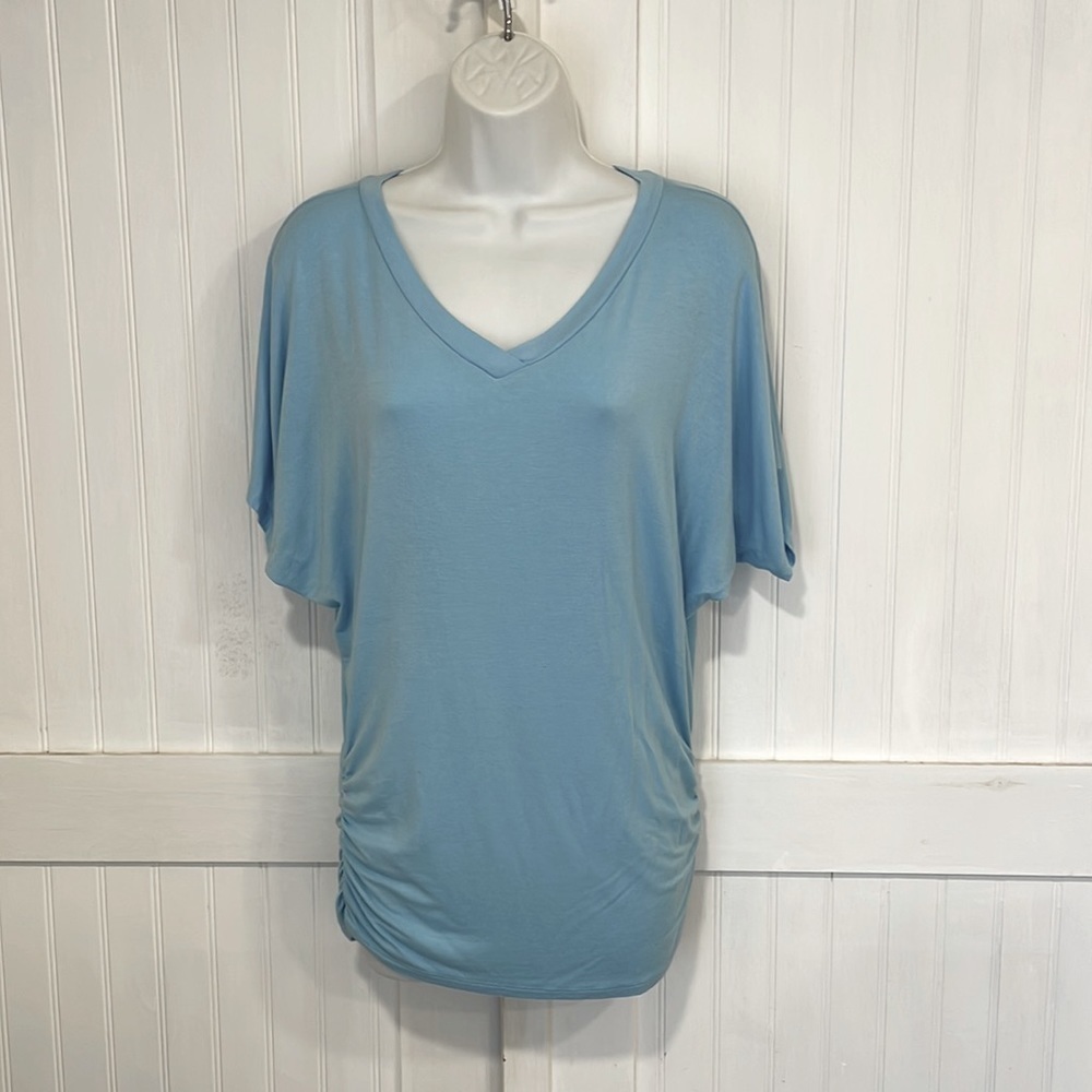 Made by Johnny designed in California. Powder blue top Roomie  size S.